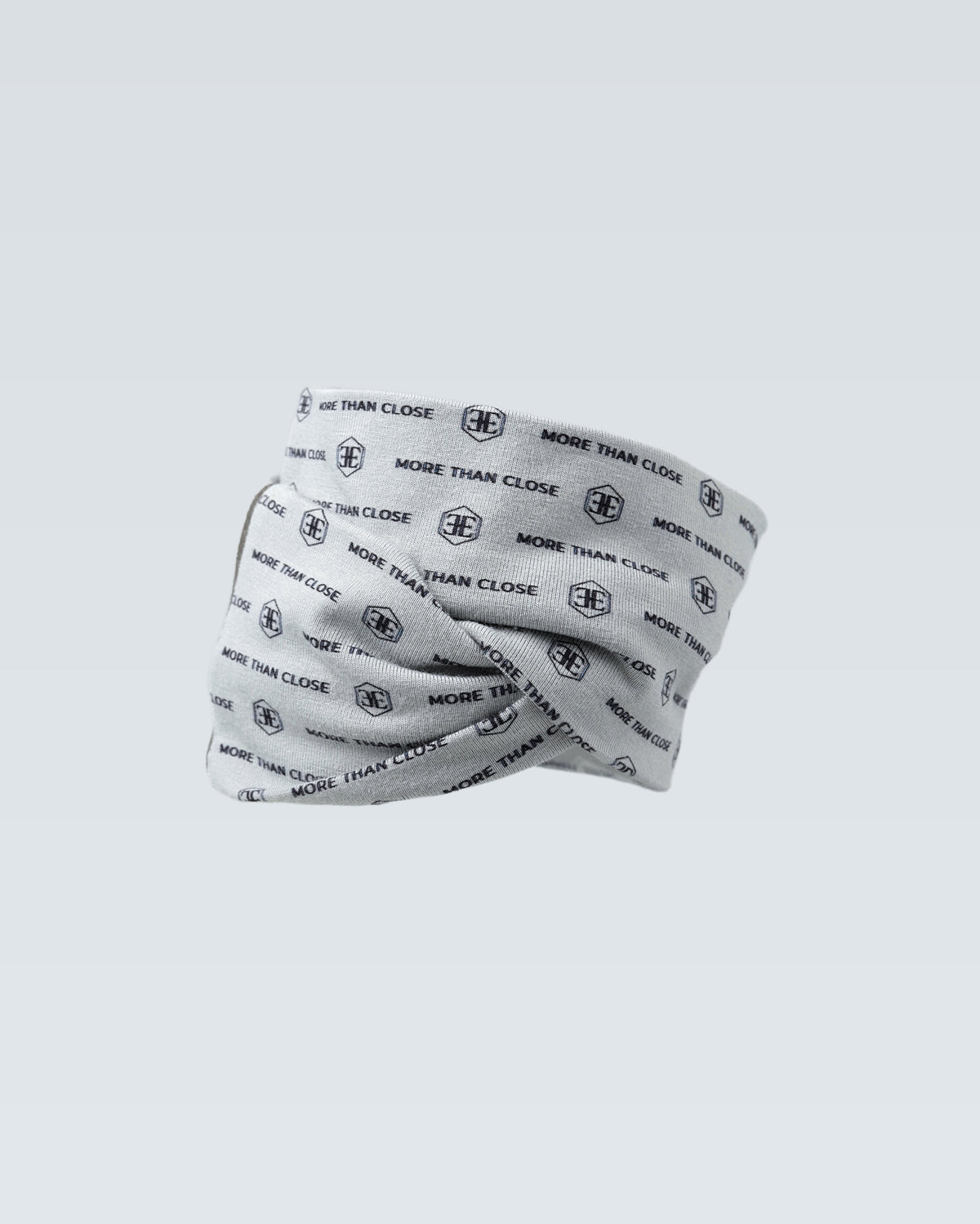The light grey printed snood folded over on itself, one edge crossing the other
