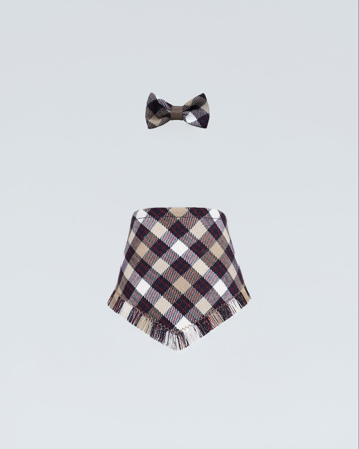 Aubergine checked bandana for dogs shown with a matching checked bow