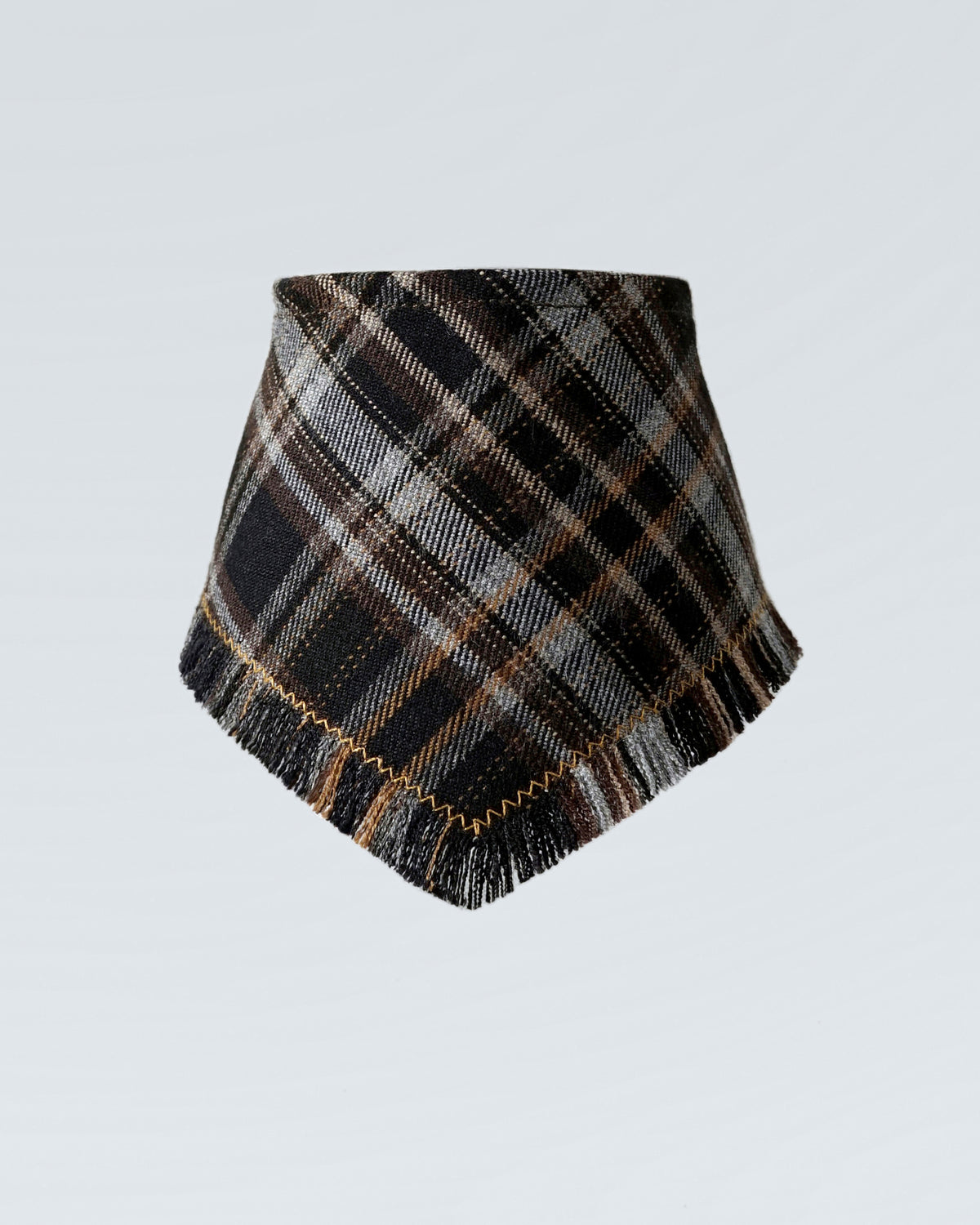 The black checked bandana seen from the front, gold topstitching following the fringed edge