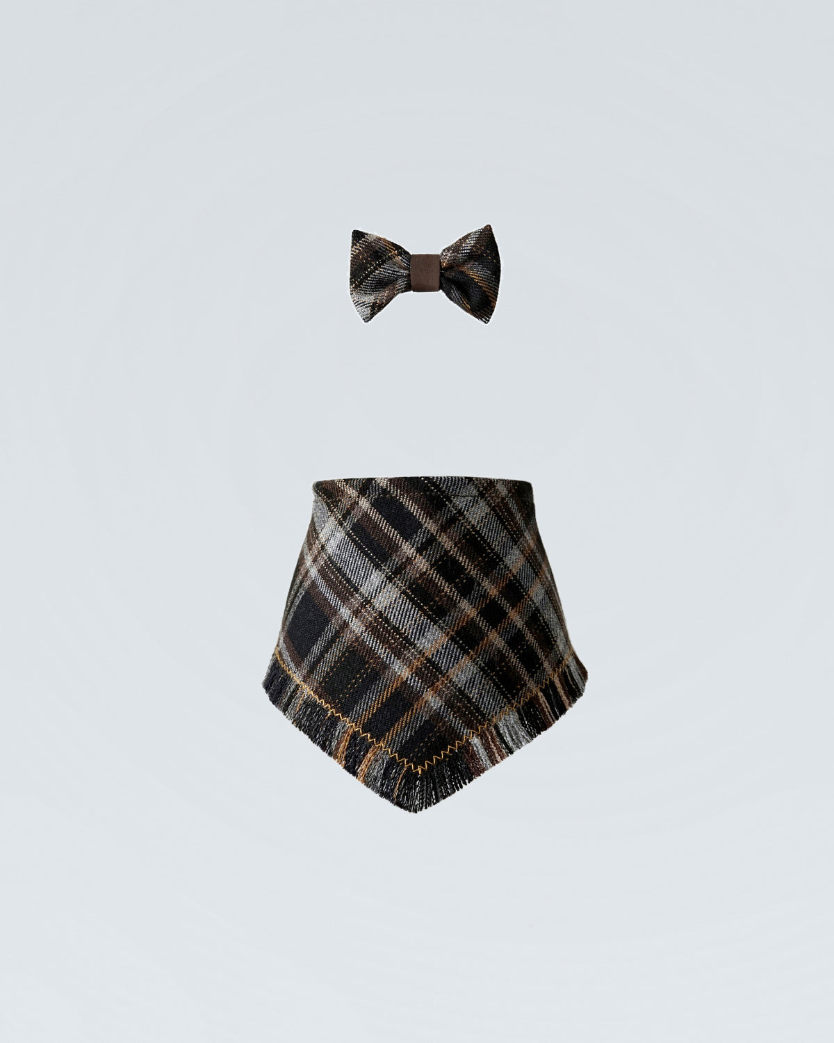 The black checked bandana shown below a matching bow tie, the two pieces laid out together